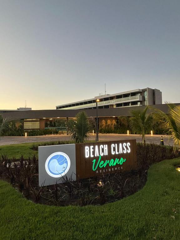 a sign in front of a building with a building at Beach Class Verano 214 C in Ipojuca