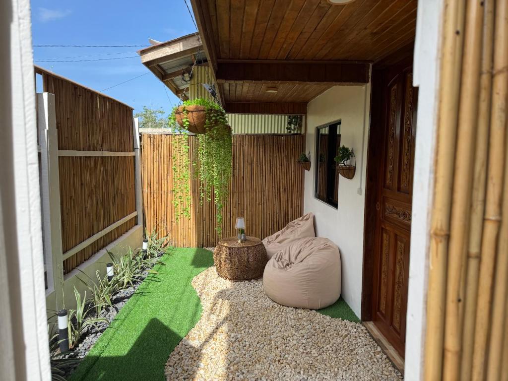 a patio with a bean bag chair and a table at Leianna House in Itaytay