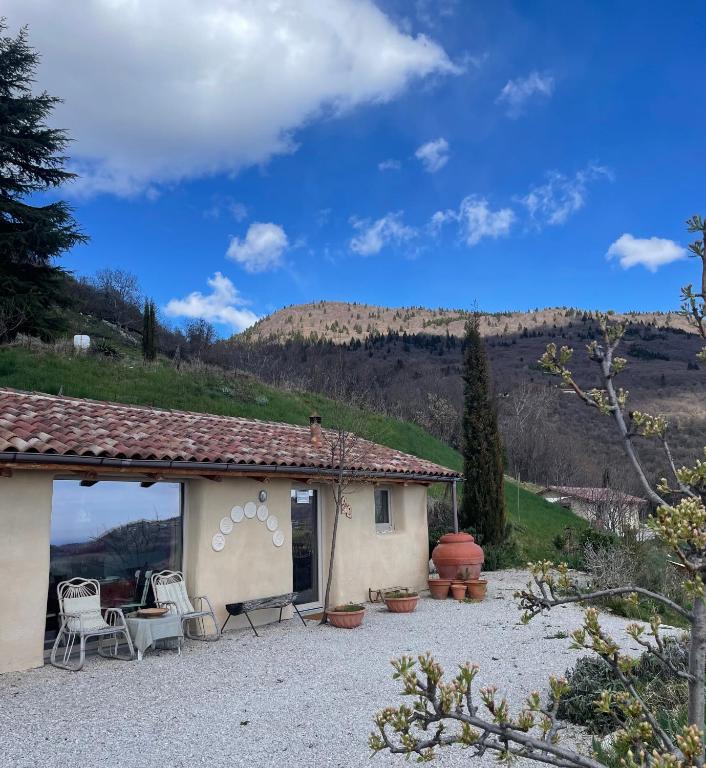 a small house with a view of a mountain at CalVenere in Calvene