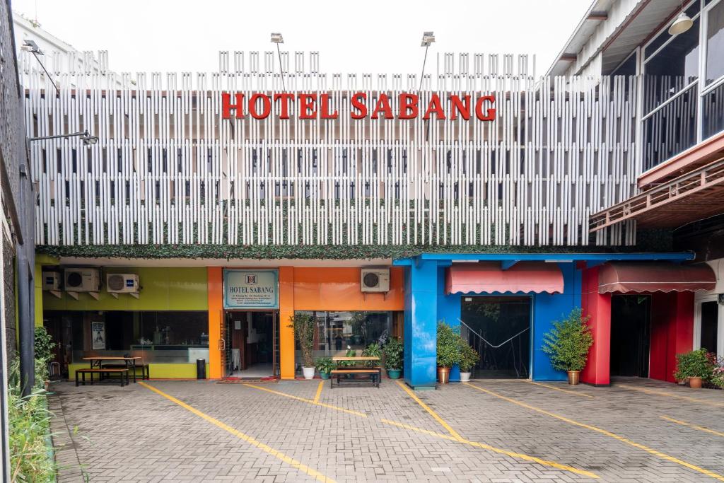 a hotel sarawak sign on top of a building at Rehat at Hotel Sabang in Bandung
