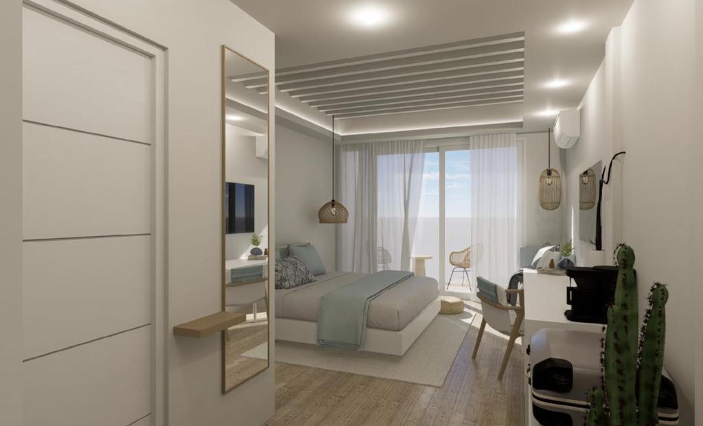 a bedroom with a bed and a desk with a mirror at Dimora Blu Maldives in Dharavandhoo