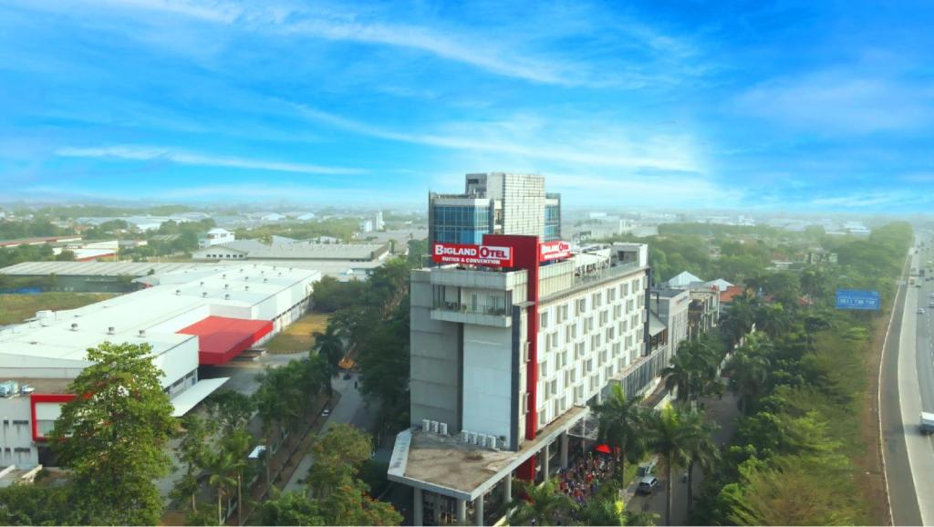a building with a coca cola sign on top of it at Bigland Hotel & Convention Sentul in Bogor