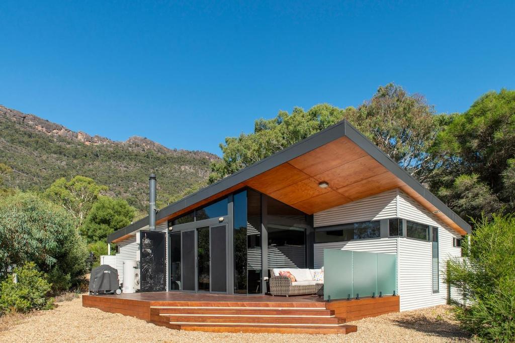 a modern house with a glass facade at Gumleaf Villa Hosted by Halls Gap Accommodation in Halls Gap