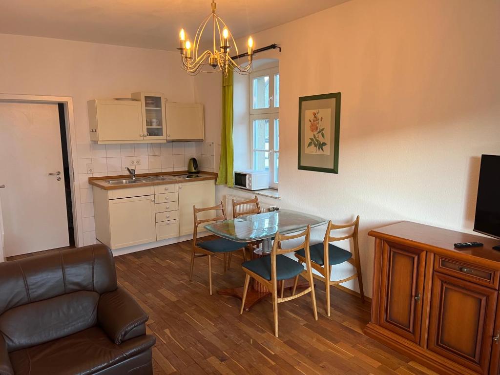 a kitchen and dining room with a table and chairs at Hugo zwei in Warburg