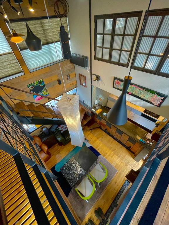 an overhead view of a living room with a table and chairs at stylish japanese beach house in Toyohashi