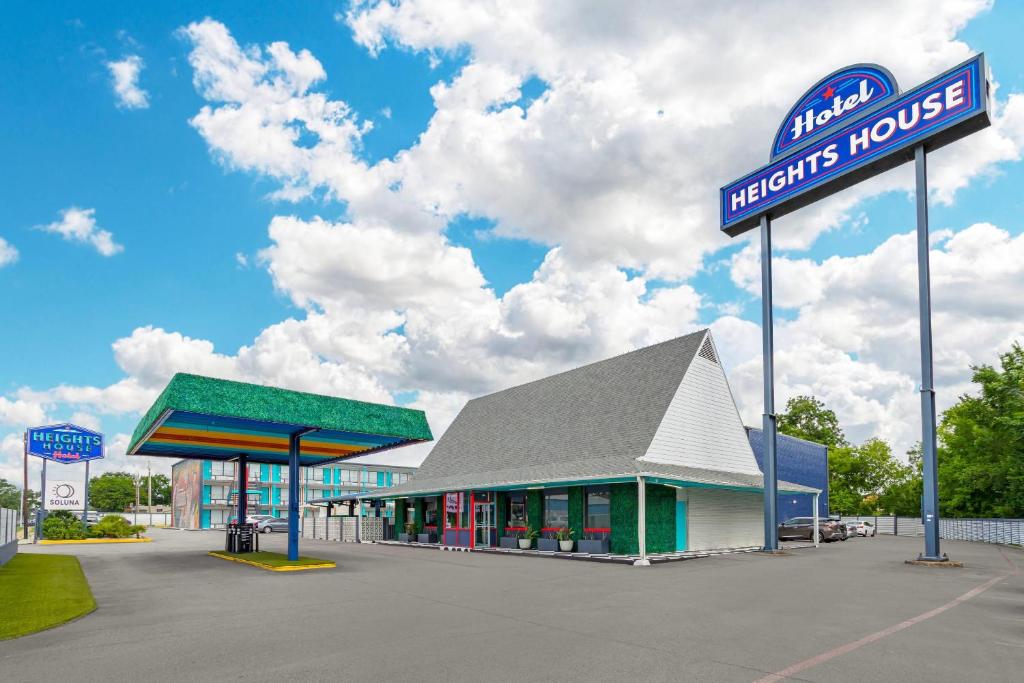 a gas station with a sign in front of it at Heights House Hotel - Houston Heights Downtown, an Ascend Collection Hotel in Houston
