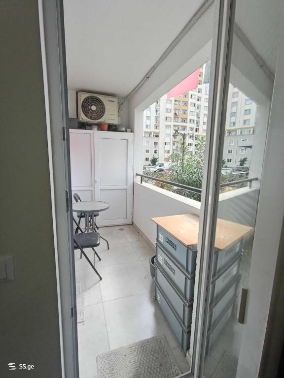 a small room with a table and a window at Tbilisi Dirsi Complex in Tbilisi City