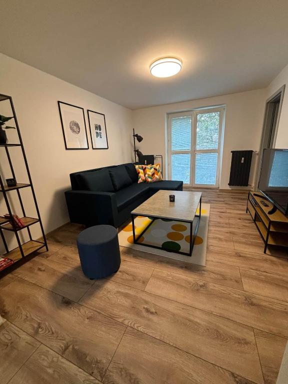 a living room with a couch and a coffee table at Hrabůvka Living in Ostrava