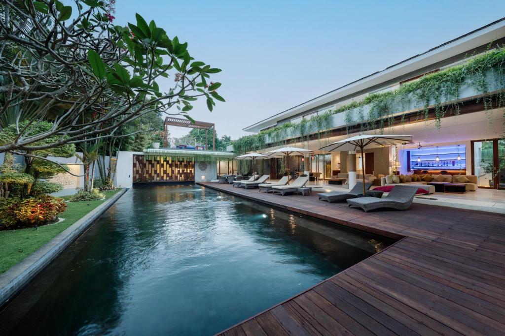 a swimming pool in the middle of a building at The Muse Luxury Eco-Living in Munggu