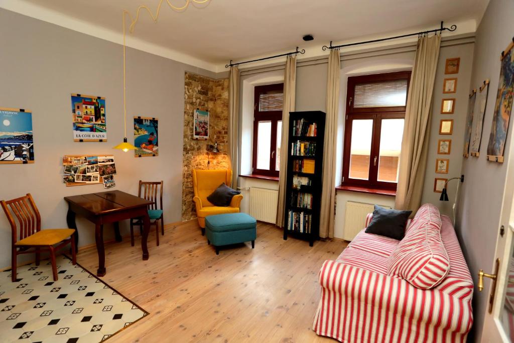 a living room with a couch and a table at Green Tree Apartment in Pécs