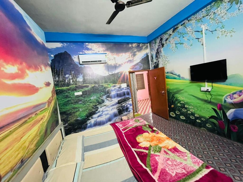 a room with a golf mural on the wall at Oyo Royal Hotel & Janmasha in Rewa
