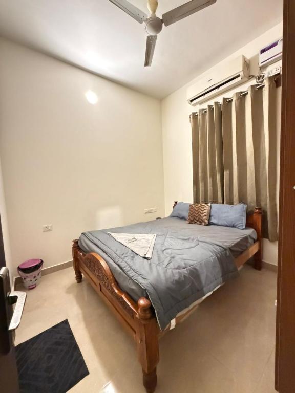 a bedroom with a bed and a ceiling at Moonstone Royal Resort in Jāmb