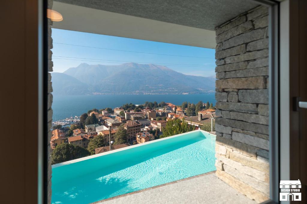 a view of the water from a house with a swimming pool at APPARTAMENTO BELAGO by Design Studio in Bellano
