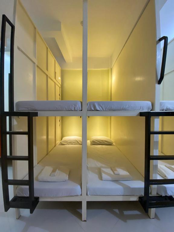 a room with two bunk beds in it at B2 Capsule Sleep Pods in Guiuan