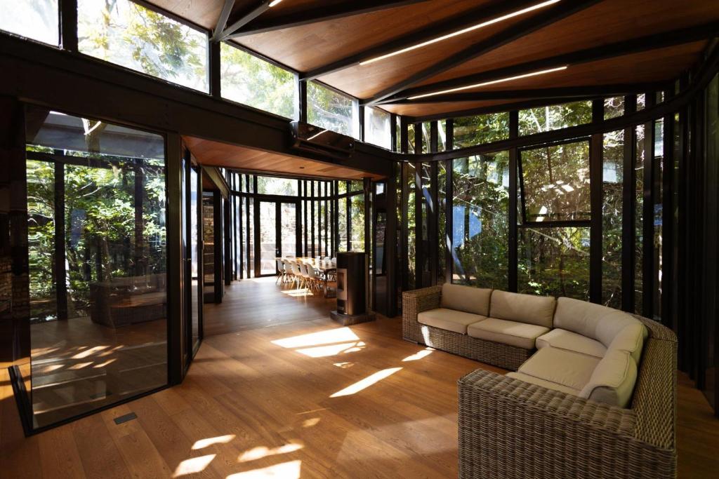a living room with a couch and some windows at Natures View in Pretoria