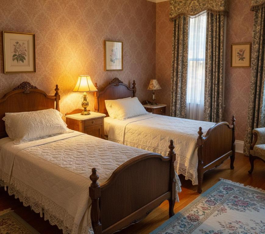 a bedroom with two beds and a chair and a window at Awex Apart in Sakarya