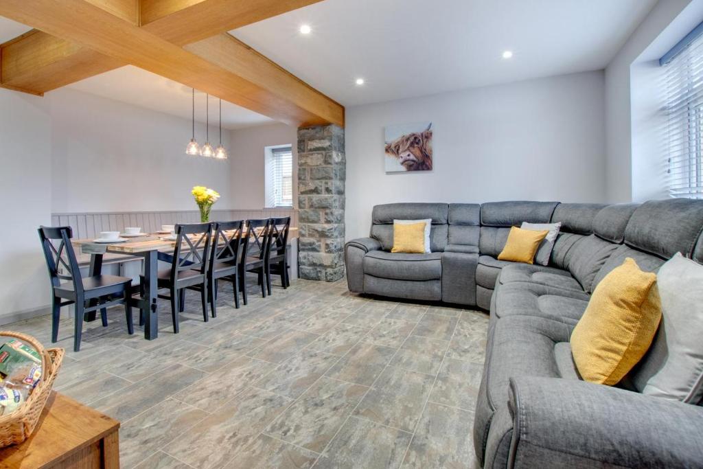 a living room with a couch and a dining room at 5 Bed in Bala oc-bow163 in Bala