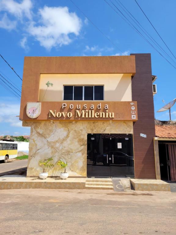 a pueblo novo minitarian building on a street at Pousada Novo Millenium in Araripina