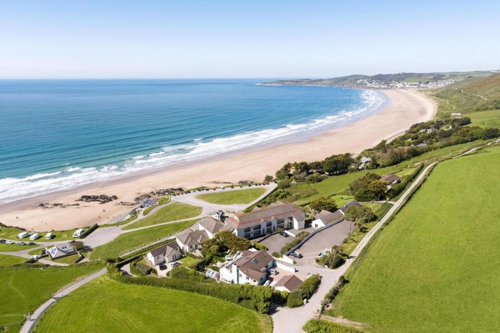 an aerial view of a house next to a beach at 2 Bed in Putsborough oc-flat31 in Croyde