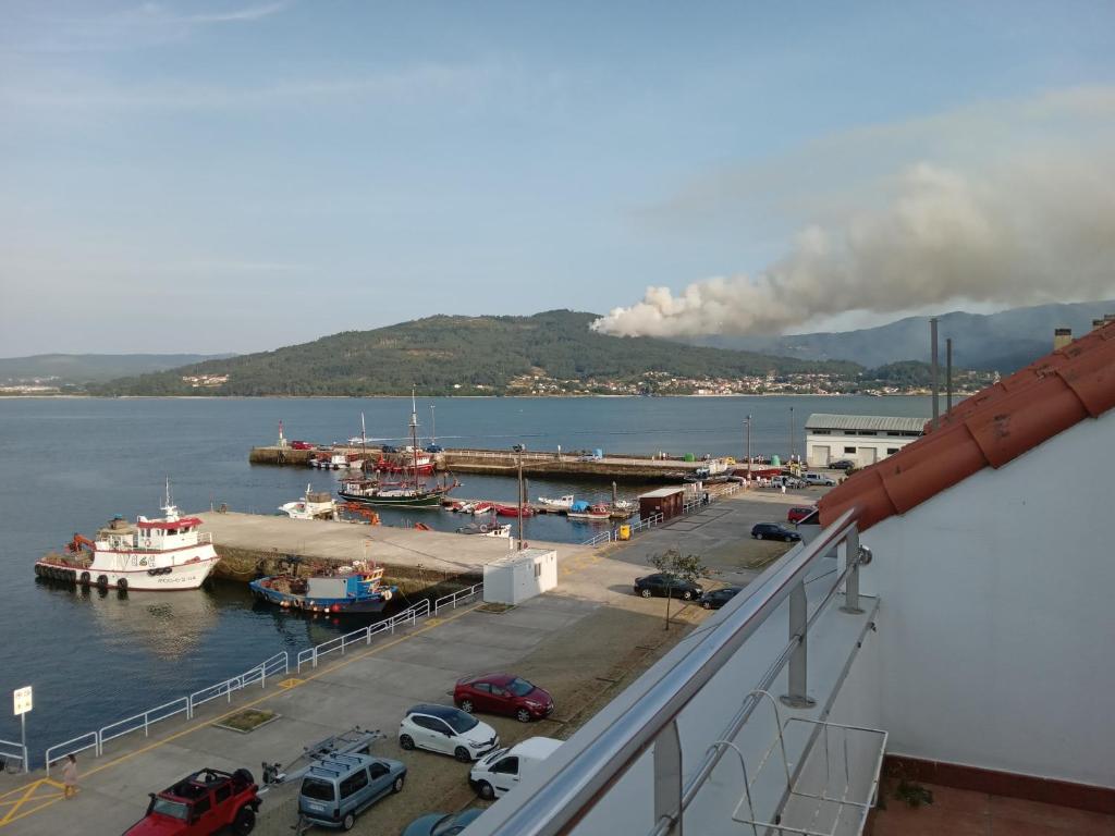 a view of a harbor with boats in the water at Piso Adrian in Sierra de Outes