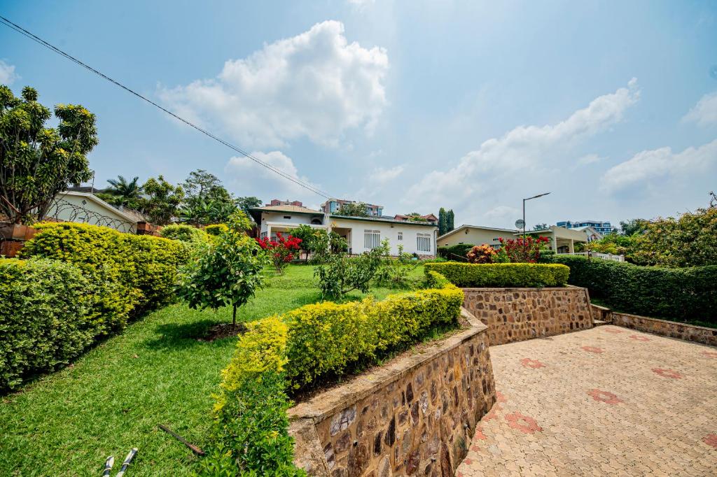 a view of a yard with bushes and houses at Nazareth Guest House in Kigali