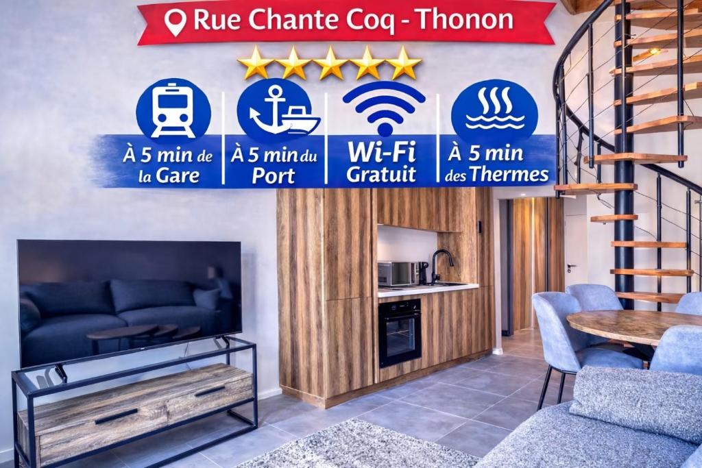 a living room with a couch and a tv at Duplex design avec balcon I Hyper centre Thonon in Thonon-les-Bains