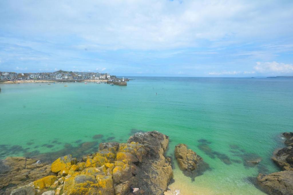 a view of the ocean with rocks in the water at 1 Bed in St Ives oc-crab02 in St Ives