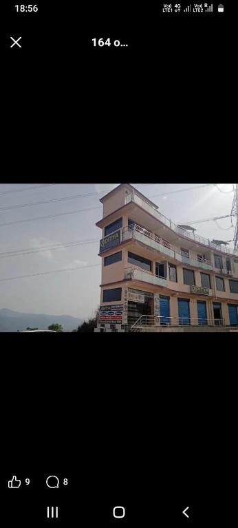 a picture of a tall building with at The aditya hotel & Resturdent in Bhukhar