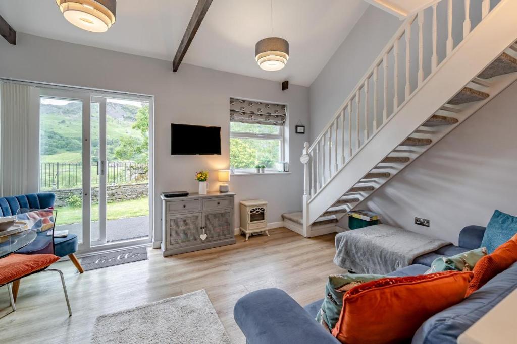 a living room with a couch and a tv at 2 Bed in Chapel Stile oc-gl103 in Chapel Stile