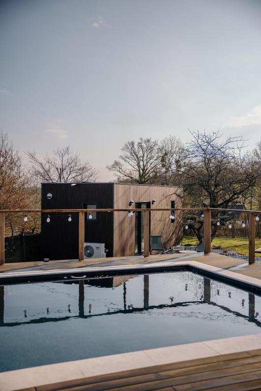 a swimming pool with a fence around it at Chez Lilie in Le Sel