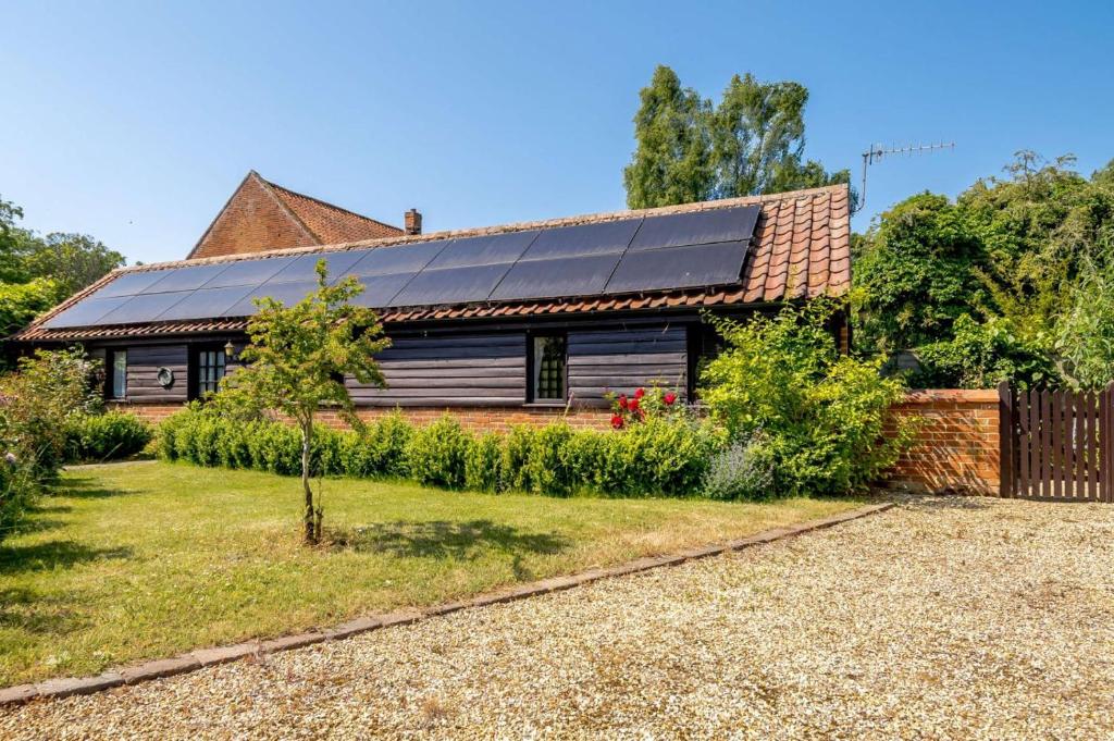 a house with solar panels on the roof at 1 Bed in Saxmundham oc-c27420 in Farnham