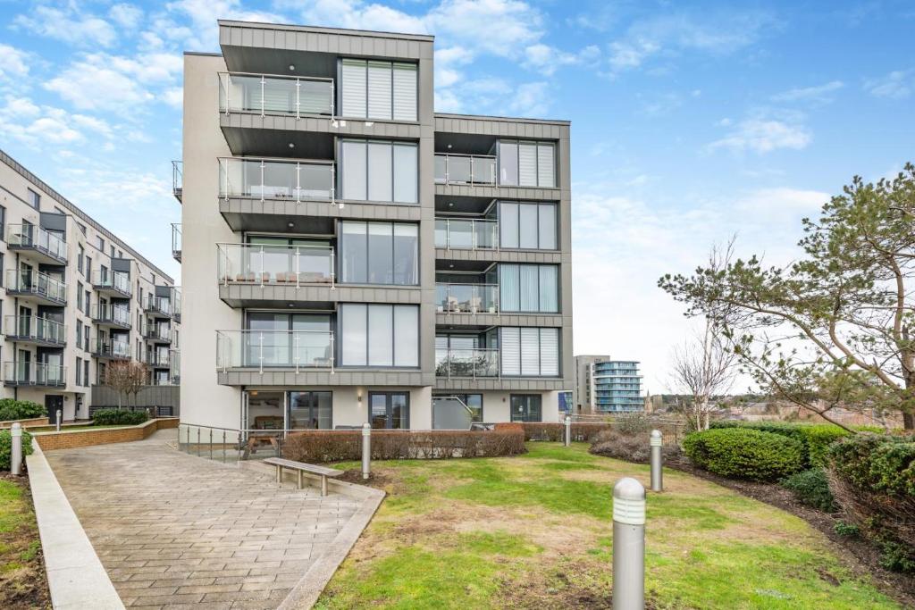 an apartment building with a park in front of it at 2 Bed in Bournemouth oc-b27914 in Bournemouth