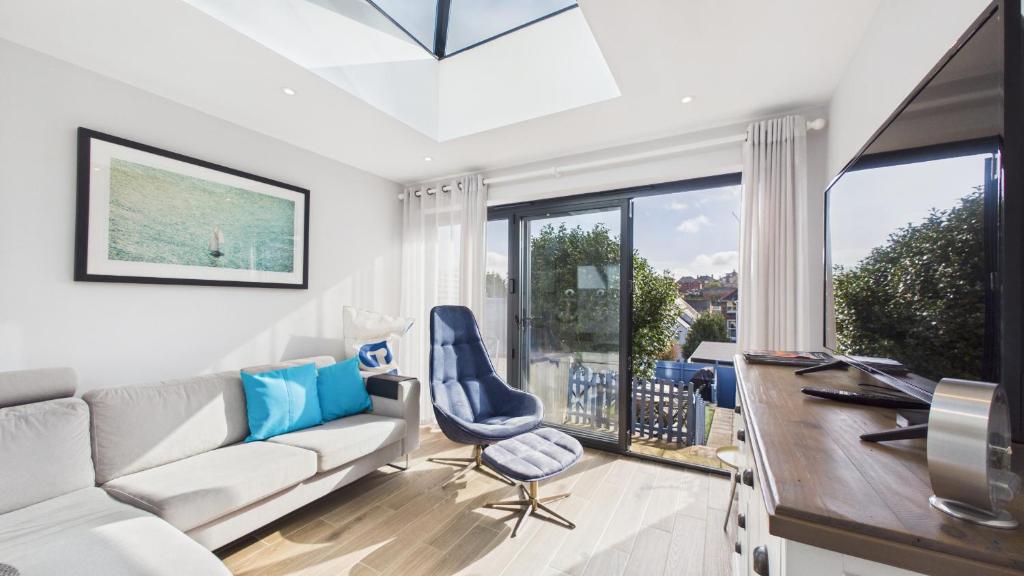 a living room with a couch and a table at 74 Granville Road in Cowes