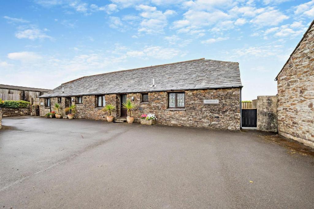 an old stone building with plants on it at 2 Bed in St. Merryn oc-w29716 in Saint Merryn