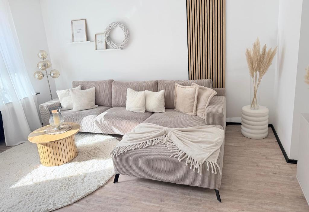 a living room with a couch and a table at R Lodge in Winterberg