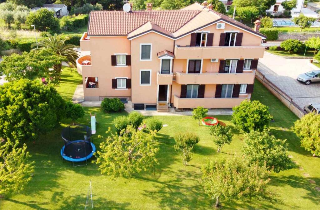 an aerial view of a house with a yard at Apartmani ANITA in Umag