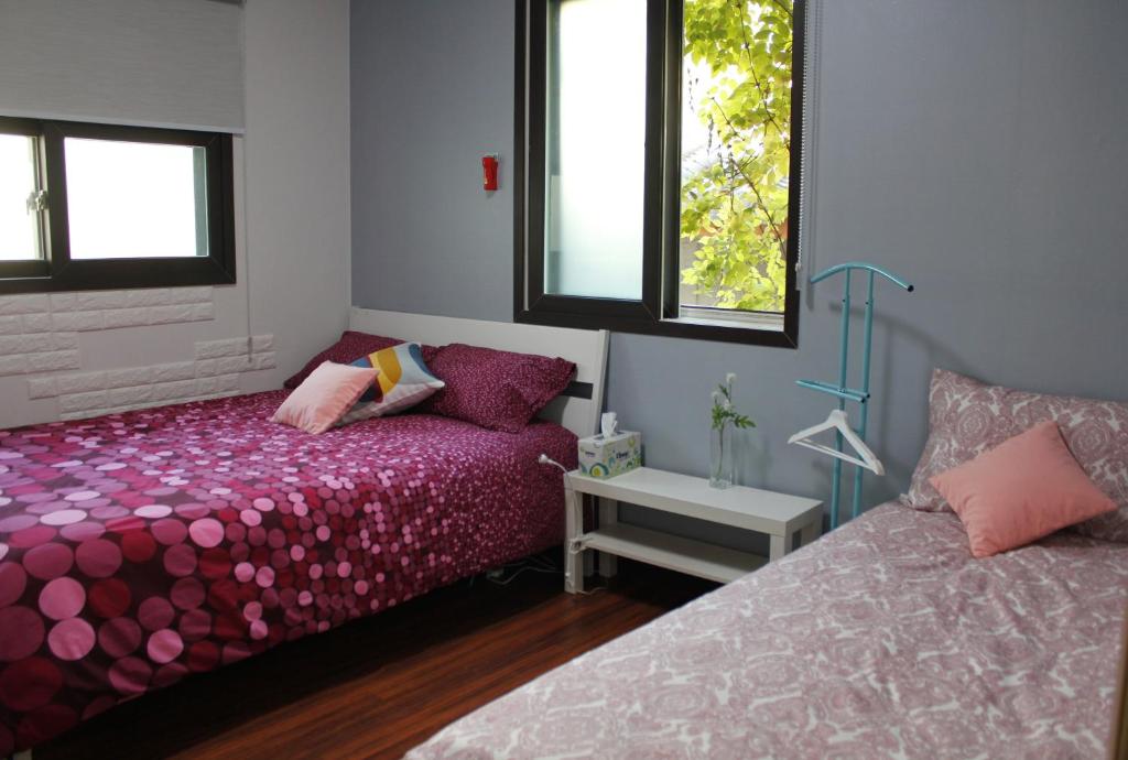 Postel nebo postele na pokoji v ubytování Jiwoljang Guesthouse