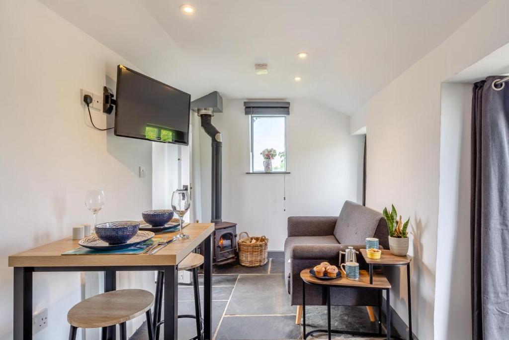 a living room with a couch and a table at 1 Bed in Morwenstow oc-t29298 in Morwenstow