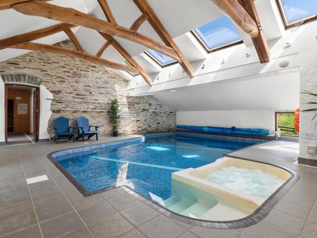 a swimming pool in a house with skylights at 4 Bed in Hebron oc-y30097 in Whitland