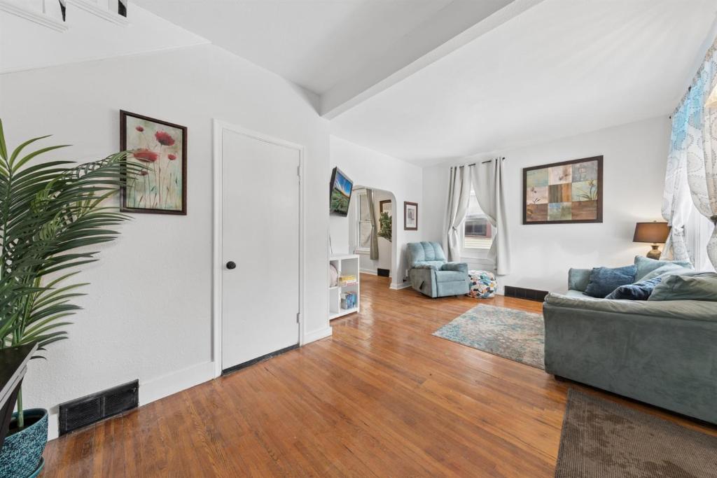 a living room with a couch and a table at 3BR Home Across from Como Lake - Aspen in Saint Paul