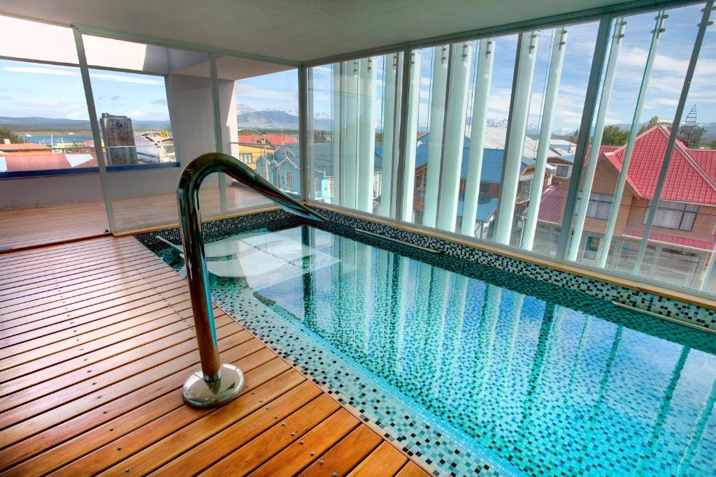 a swimming pool on the top of a building at Natalino Hotel Patagonia in Puerto Natales