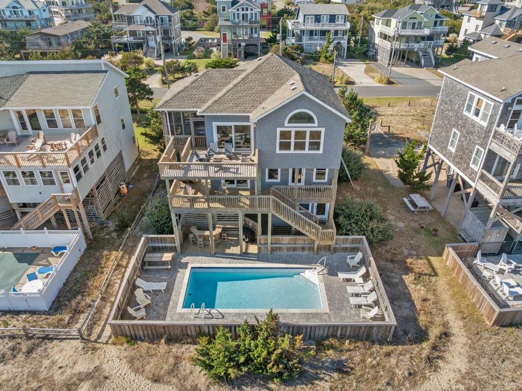 an aerial view of a house with a swimming pool at HIWA03: Lands End in Waves