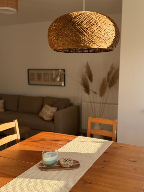 a dining room table with a candle on top of it at Casa Tilly - Ferienhaus am Wald in Zwingenberg