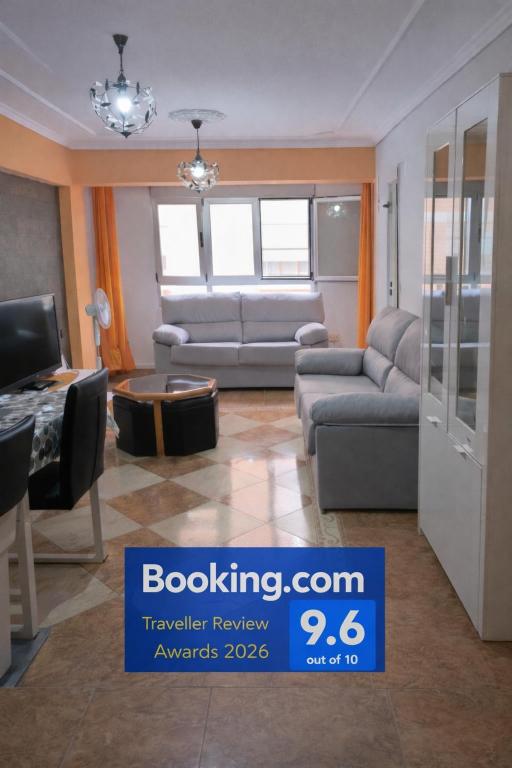 a living room with a couch and a table at Ka la paca in Grao de Castellón