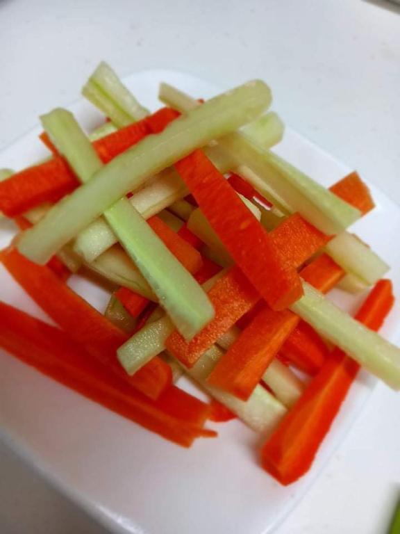 a pile of vegetables on a white plate at Moktan Homestay in Pakhyong