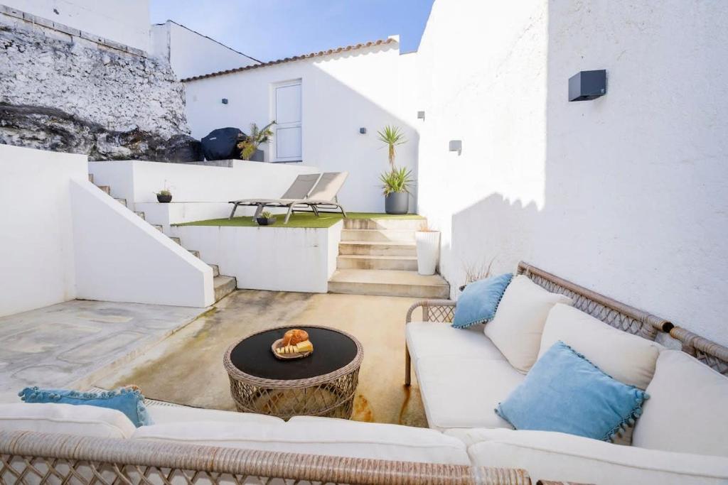 a living room with a couch and a table at GuestReady - Sea Escape Azores in Lagoa