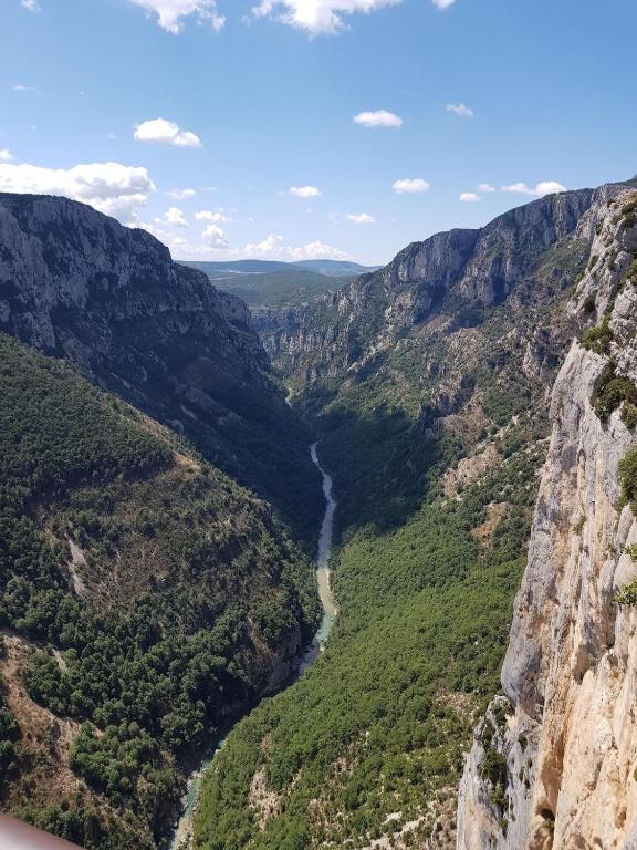 a view of a canyon with a river at Logis du Grand Puits in Baudinard