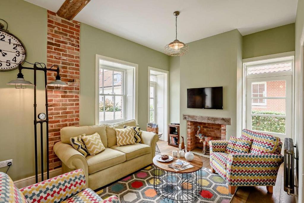 a living room with a couch and a fireplace at 2 Bed in Blythburgh oc-t27735 in Blyford