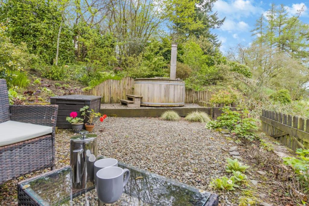 a garden with a hot tub and a patio at 3 Bed in Knighton oc-b29329 in Felindre