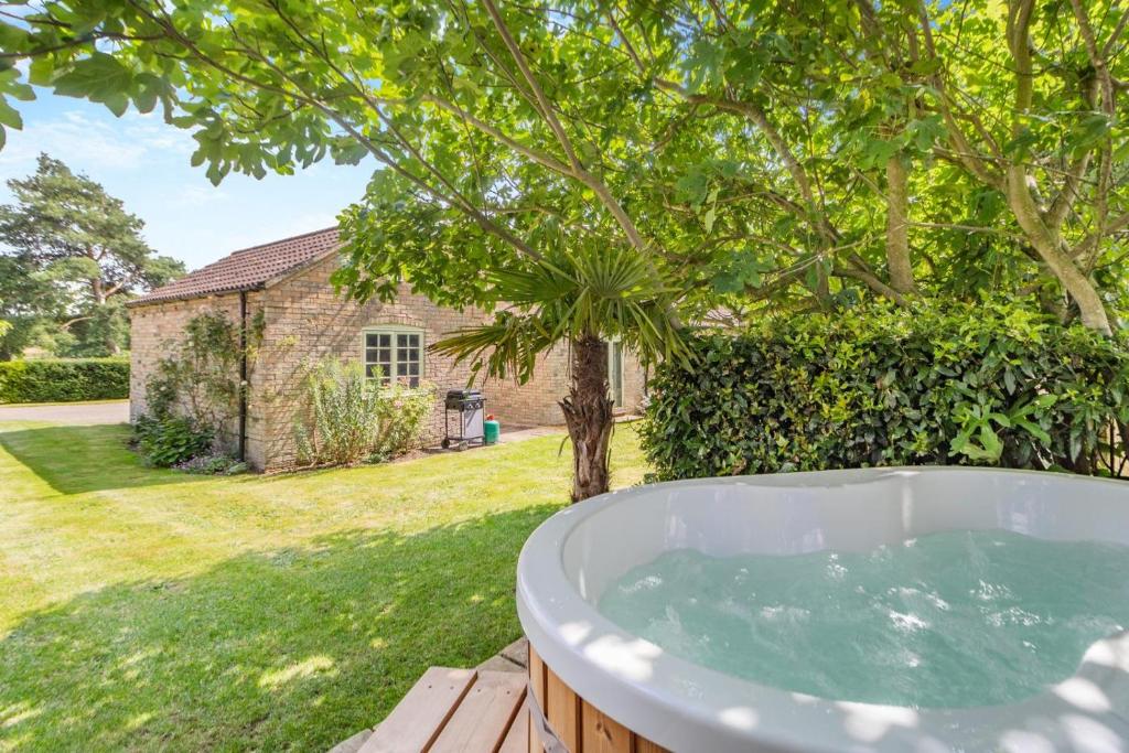 a bath tub in the backyard of a house at 2 Bed in Oxborough oc-r29290 in Oxborough
